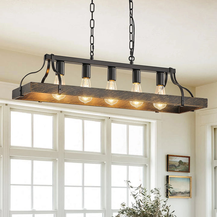 Antique black and gold chandelier in a bright dining room with adjustable chain.