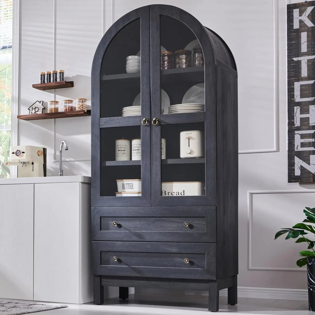 Alternate angle of the tall arched kitchen pantry cabinet in a dark wood finish, showcasing the glass doors and spacious interior for dishes and pantry items.