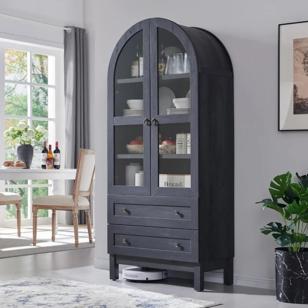 Side-angle view of a tall arched kitchen pantry cabinet in a dark finish with glass doors, perfect for farmhouse or modern kitchens.

