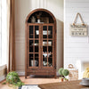 Black farmhouse-style arched cabinet with glass-paneled doors, perfect for tall bookshelf or pantry use.