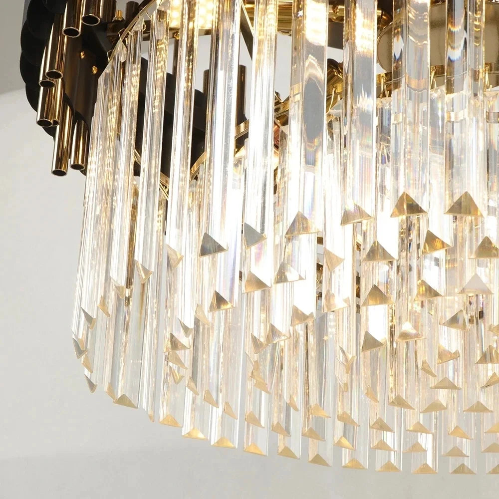 Close-up of sparkling crystal chandelier design with black and gold elements.