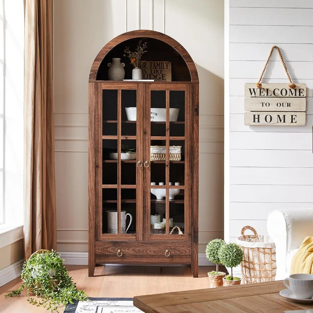 Farmhouse arched cabinet with glass doors in rustic brown, offering elegant kitchen pantry storage.