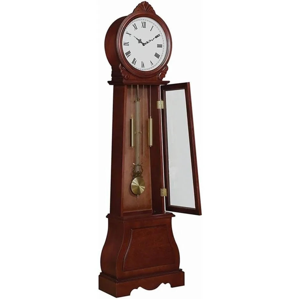 Grandfather clock with a glass front and brass pendulum in brown-red wood finish, placed in a room.