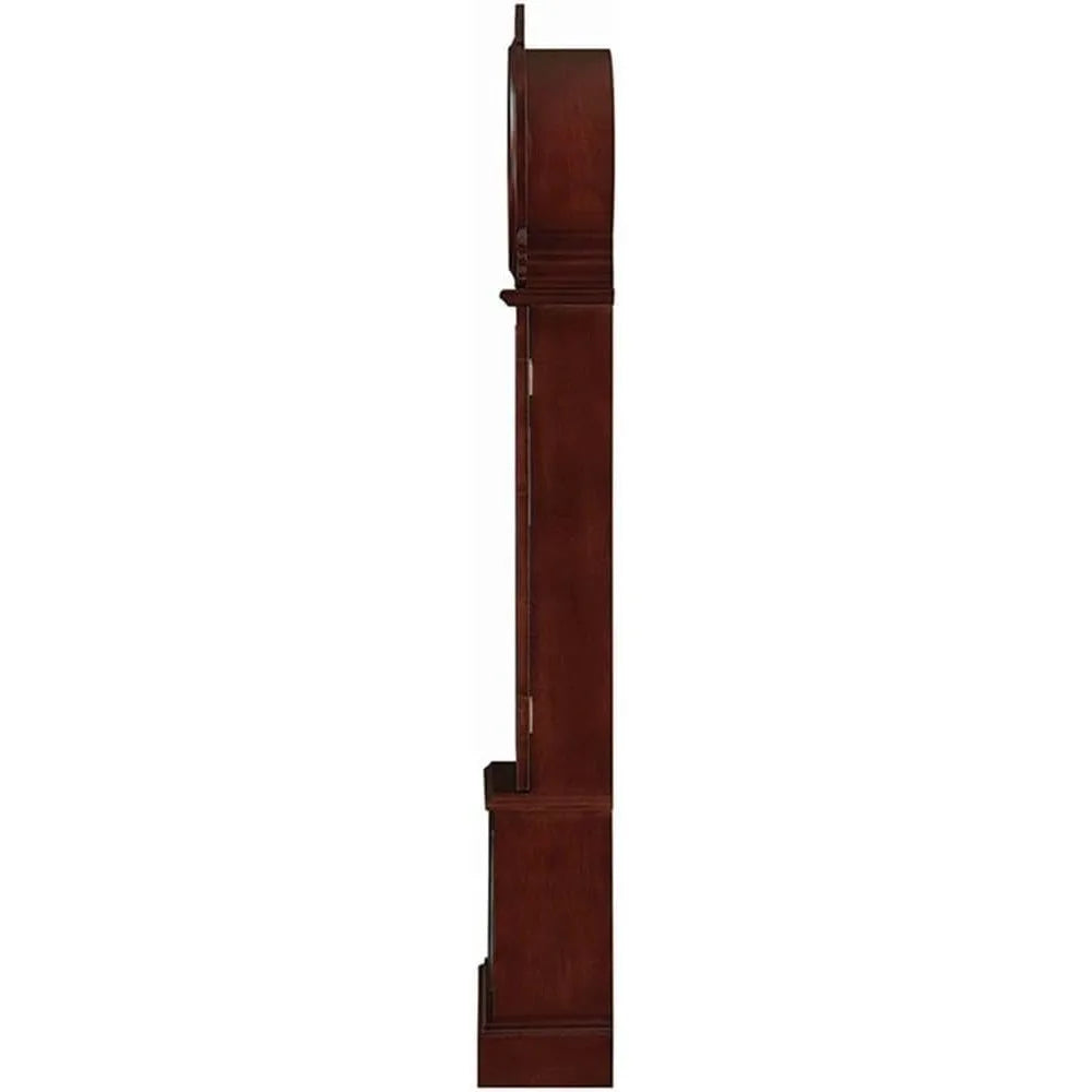 Side view of a brown-red Grandfather clock with brass pendulum and detailed woodwork.