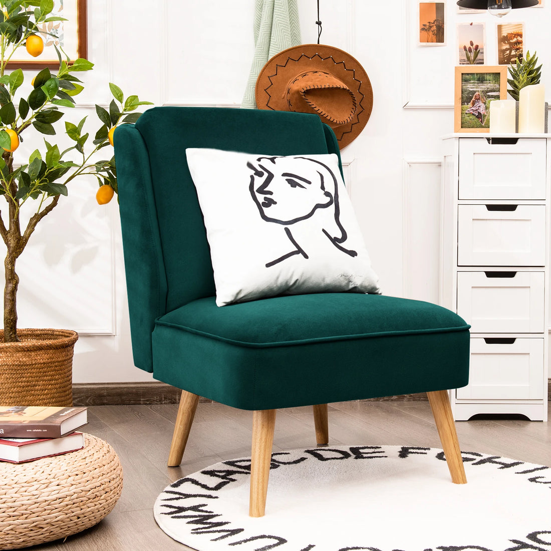 Close-up of a green accent chair showcasing plush upholstery and a decorative throw pillow, highlighting comfort and style.