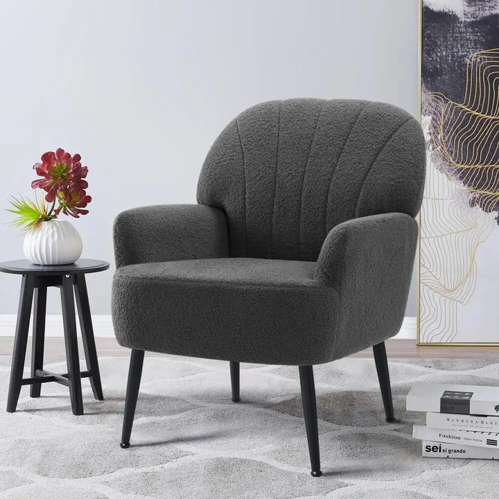 Front-angle view of a grey wool fabric accent chair with a curved back and metal legs, perfect for a modern living room or reading nook.

