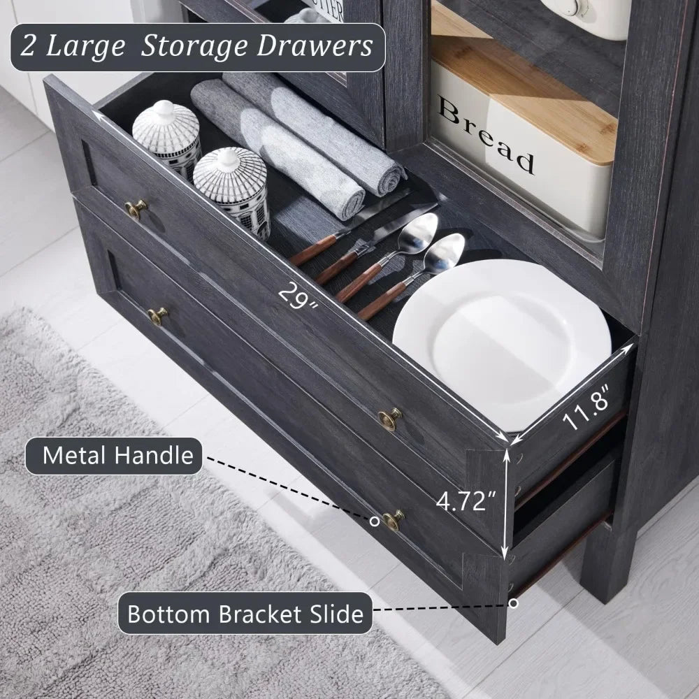 Open view of the large storage drawers in a farmhouse-style pantry cabinet, showing utensil organization and metal handle design.

