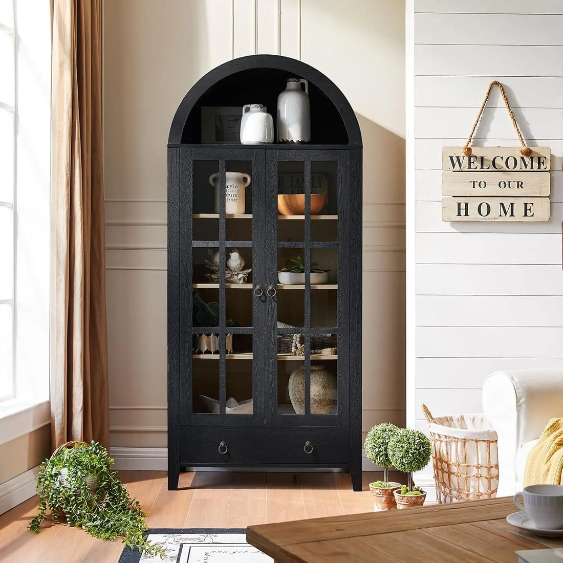 Rustic brown farmhouse arched cabinet with elegant glass doors and a spacious interior.