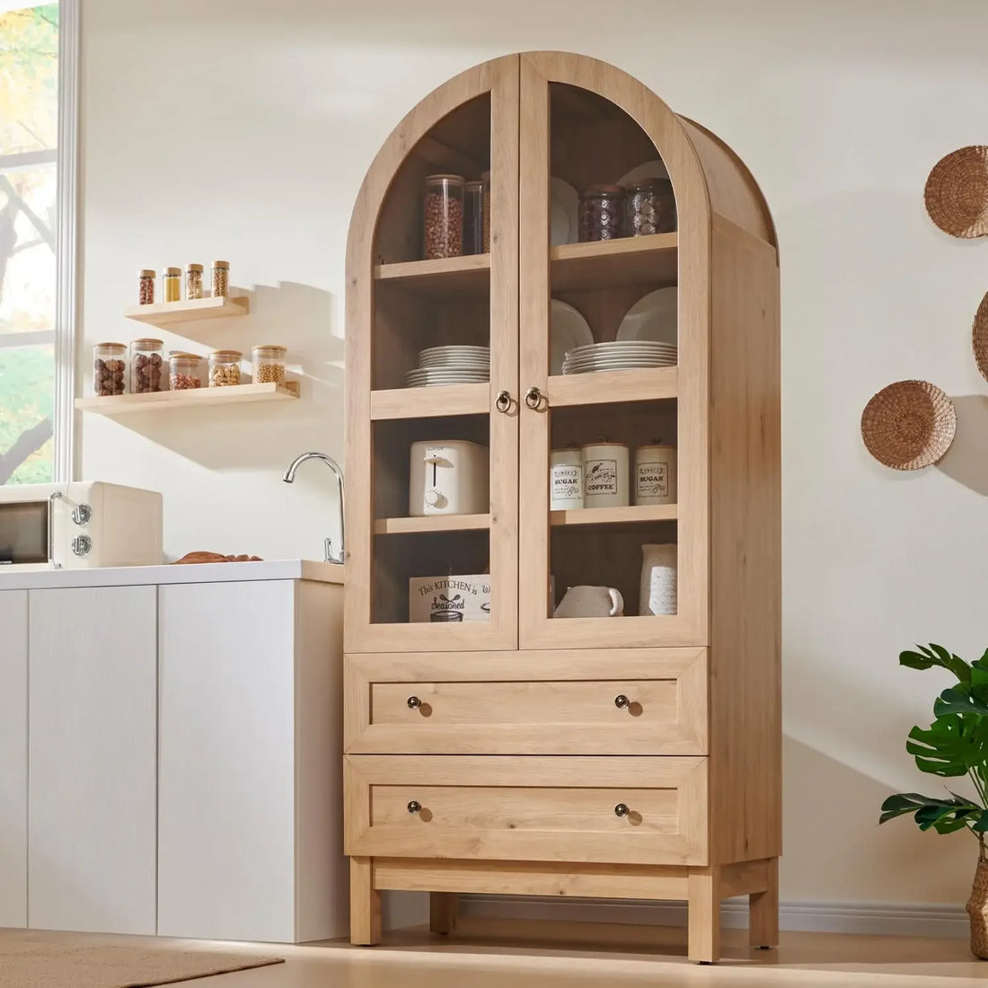 A 71-inch tall arched pantry cabinet in a natural wood finish with glass doors, two drawers, and adjustable shelves for rustic kitchen or dining room storage.