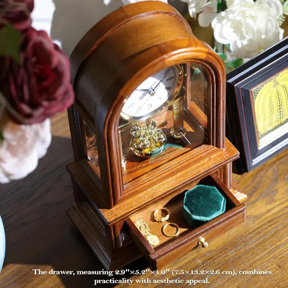 Wooden Table Anniversary Clock with Revolving Pendulum and Opened Drawer Showing Jewelry and Keepsakes.